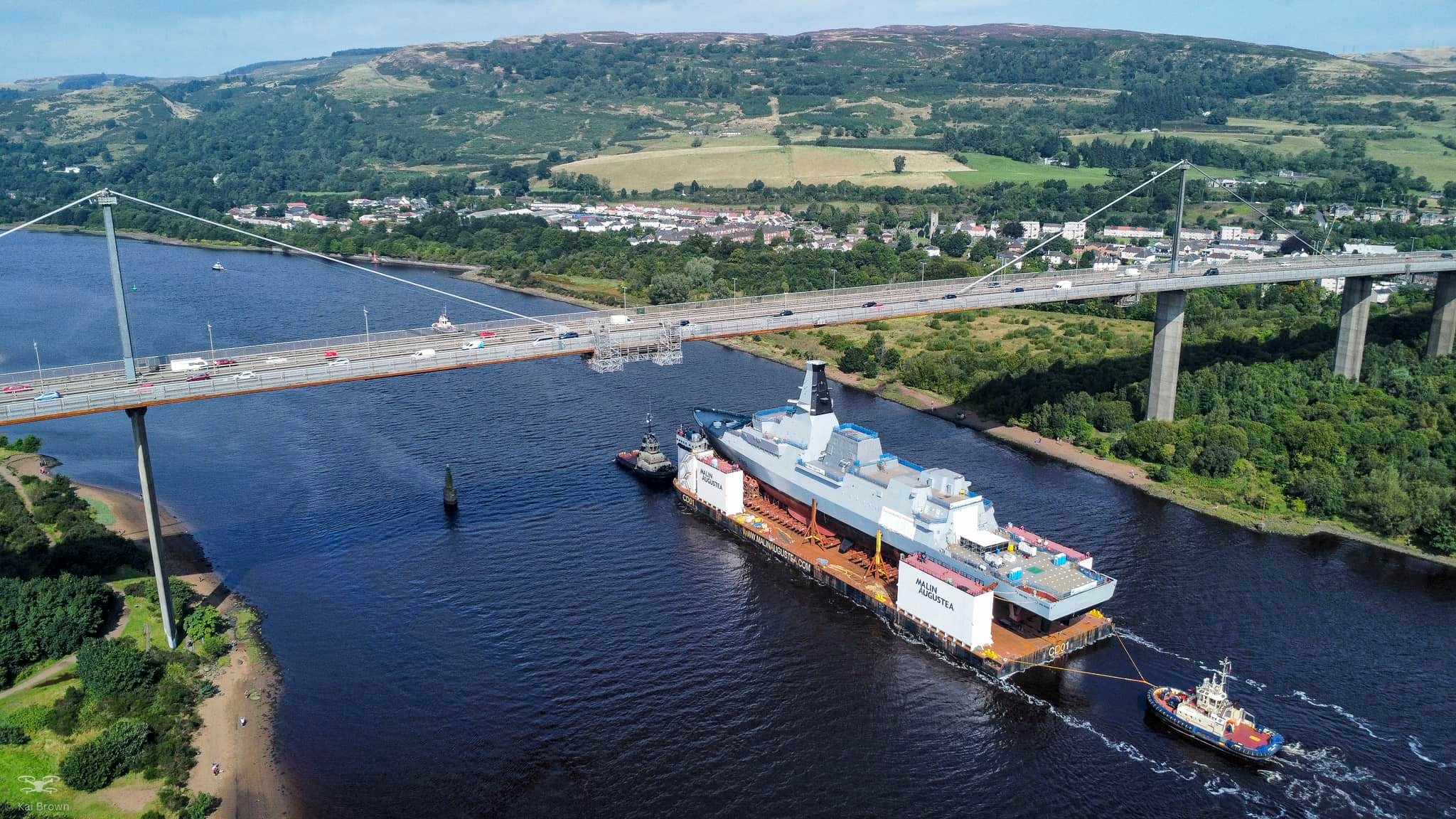 Barge carrying HMS Cardiff down the River Clyde from the Erskine Bridge